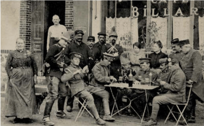 British soldiers and French cavalrymen fraternize outside a café, 1914. The Mons campaign of August strained inter-Allied relations.